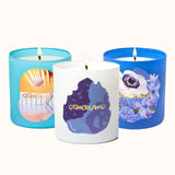 Three candles with colorful labels on a white background