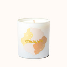 Candle with 'Otherland' branding on a white background