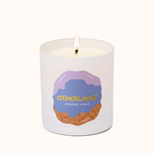 Candle with 'Otherland' branding on a white background