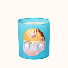 Blue candle with a shell design and 'Otherland' text on a white background