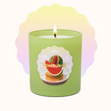 Green candle with watermelon design on a white background