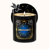 Black candle with 'Otherland' branding and celestial designs on a white background