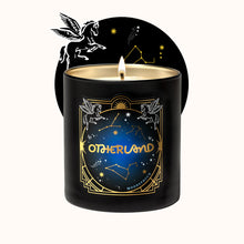 Black candle with 'Otherland' branding and celestial designs on a white background