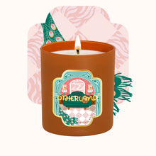 Candle in a decorative container with a colorful label on a white background