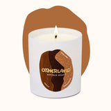 Reverie Roast candle with 'Otherland' branding on a white background