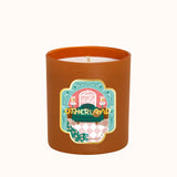 Candle in a brown container with a colorful label on a white background