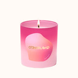 Pink candle with a gradient design and 'Otherland' branding on a white background