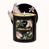 Black candle with floral design and 'Otherland' branding on a white background