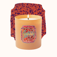 Candle with a colorful label on a white background