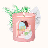 Pink candle with decorative design and 'Otherland' text on a white background