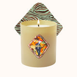 Candle with a decorative label and zebra-patterned lid on a white background