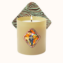 Candle with a decorative label and zebra-patterned lid on a white background