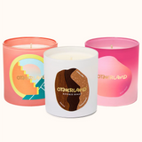Three candles with colorful labels on a white background