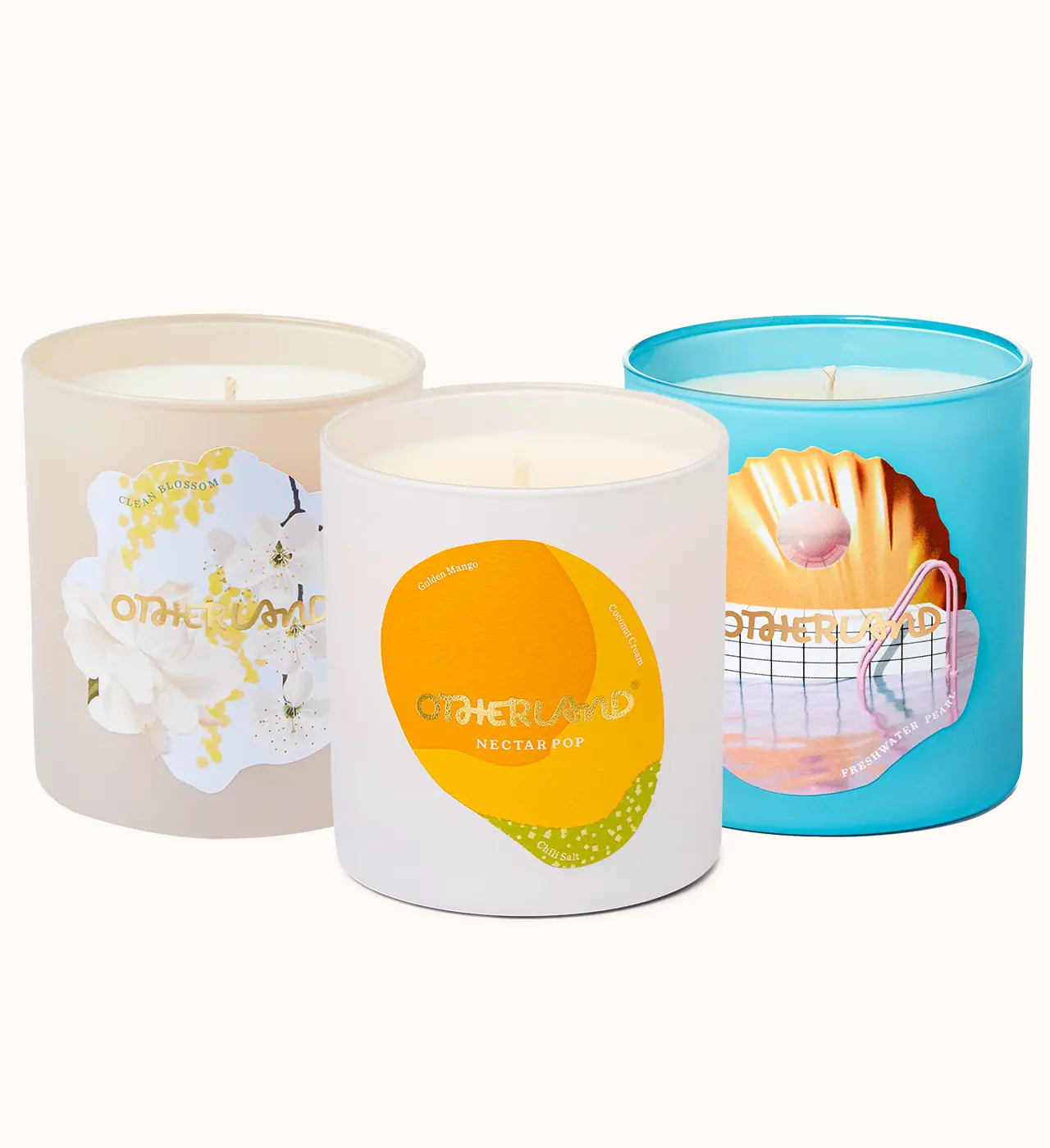 Three candles with different designs on their containers against a white background - View 0