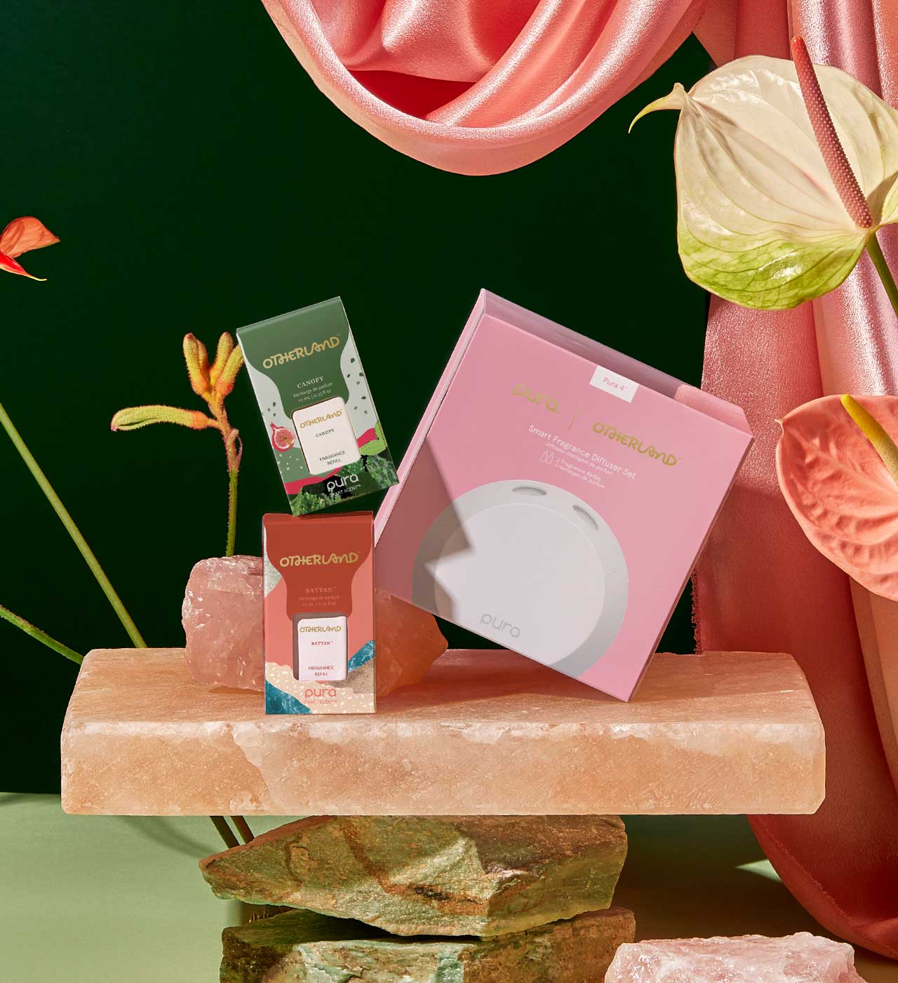 Pura diffuser kit on a pink stone surface with flowers and fabric in the background - View 5