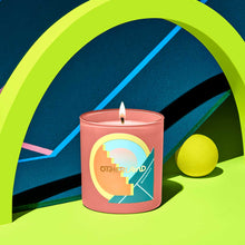 Candle with a colorful label on a vibrant background