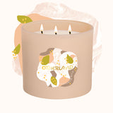 Candle with a decorative label on a white background