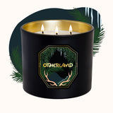 Black candle with gold interior and 'Otherland' logo on a white background