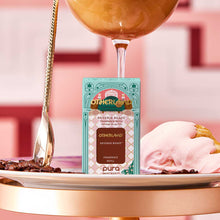 Pura smart fragrance refill packaging with a glass of coffee and ice cream on a pink background